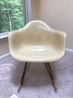 Front view of fiberglass shell and rocker base