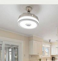 Ceiling fan installed in kitchen setting, showing fan extended with LED light illuminated.