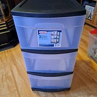 Full view of Sterilite 3 drawer plastic storage cart showing black frame and translucent drawers.