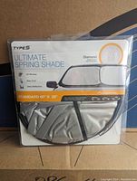 Front packaging of Type S Ultimate Spring Shade car sunshade showing brand, product name, features, and size 60x28 inches.