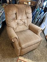 Front view of brown fabric La-Z-Boy recliner chair with cushioned backrest and padded armrests.