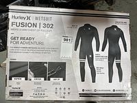 Box front of Hurley Fusion 302 wetsuit showing brand, model, product details, and features.