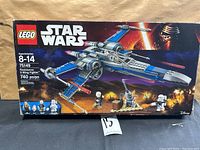 Front of LEGO Star Wars box showing Resistance X-Wing Fighter image and 740 pcs count