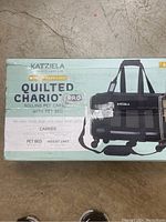 Front side of product box showing Katziela branding, Quilted Chariot Pro model, features and use for small pets.