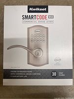 Front of the Kwikset SmartCode 955 lock box showing product image and key features.