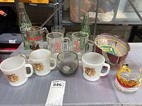 Full lot including glass mugs, collectible bottles, and small dish