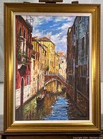 Framed painting of Venice canal with gondola, showing full artwork and frame.