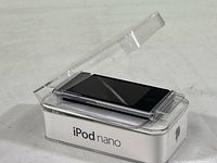 Apple iPod Nano 16GB inside clear plastic packaging box.