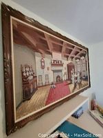 Full angled view of large framed Gobelin tapestry depicting Flemish sewing class scene with furniture and architectural details.