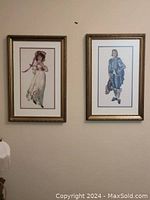 Pair of framed petit point artworks hanging on wall showing Pinky and The Blue Boy.