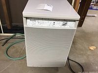 Front view of Danby dehumidifier showing air intake grille, brand label, and control knob.