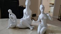 Photo showing all three Royal Dux white porcelain nude figurines with smooth finish and stylized features