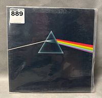 Front cover of vinyl record sleeve featuring prism and rainbow light design.