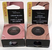 Photo showing two Burt's Bees Color Nurture cosmetic products in original unopened packaging, one cream blush and one cream eye shadow.