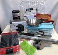 Full lot overview including skillet, cooling rack, kitchen beater, storage container, rolling pin, spatulas, and other kitchen tools.