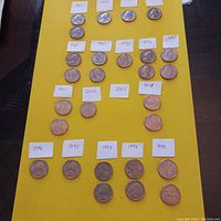 Two images showing American quarters from 1965 to 2008 arranged on yellow paper with handwritten date tags.
