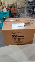 Sealed branded cardboard box of Excalibur food dehydrator model 3926T.