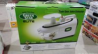 Original box of the Green Star Elite Jumbo Twin Gear Juice Extractor with branding and product image