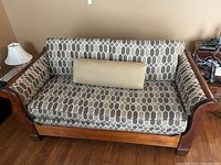 Front view of sofa with seat and back cushions and bolster pillow