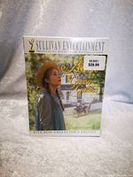 Front view of the unopened Anne of Green Gables 5-disc DVD set with cover showing the main character and background scenery.