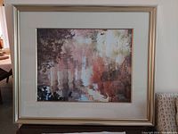 Framed signed artwork measuring 35x29 inches with reflective water and nature scene.