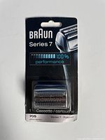 Front view of Braun Series 7 replacement shaver cassette in original packaging showing model 70S and 100% performance graphic.