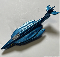 Top view showing metallic blue Batmarine toy with cockpit and wingspan.