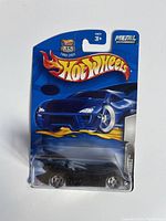 Front view of sealed Hot Wheels Batmobile die-cast car in original packaging with 35th anniversary Hot Wheels logo.