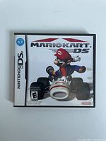 Front cover of Mario Kart DS Nintendo DS game case showing Mario in a kart and game title.