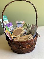 Woven basket filled with assorted craft supplies visible including scissors and packaged items
