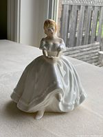 Front view of Royal Doulton Heather figurine showing detailed dress and face