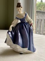 Front side view of the Royal Doulton Pretty Ladies Alyssa figurine showing the detailed dress and pose.