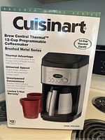 Box of Cuisinart Brew Central Thermal 12-Cup Programmable Coffee Maker showing front with product name, features and image.