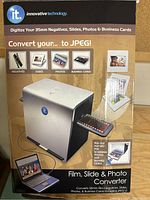 Photo of the front and side of the boxed Film, Slide & Photo Converter with branding and function info