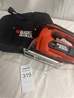 Photo showing the Black & Decker jigsaw saw and its carrying case with a MaxSold label