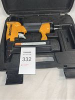 Bostitch nailer in carrying case, showing the whole kit including magazines and interior case molding.