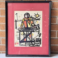 Full view of framed abstract print with red mat and black frame, showing stylized figure with geometric shapes and bright colors.