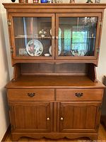 Front view of the solid maple hutch and buffet cabinet showing glass doors, drawers and cabinet doors