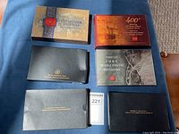 Six presentation cases laid out showing years and packaging styles