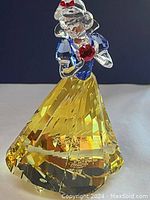 Front view of Snow White figurine on white surface