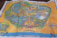 Photo of the full Disneyland park map from 1968, colorful print showing park layout, attractions, and pathways.