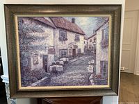 Frontal photo of the framed painting showing the full artwork and frame.