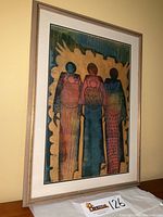 Framed watercolor painting titled Three Mothers by Lanre Job, shown full view