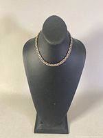 Full view of 16 inch choker necklace displayed on black bust, showing overall length and style.