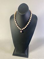 Full view of the 19-inch necklace draped on a black bust