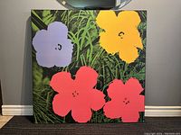 Full view of the litho print featuring colorful flowers on a leafy background, showing condition and colors.