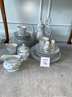 Full set of Mikasa Precious Blue Michelle china including plates, bowls, teacups, saucers, sugar bowl, creamer, and teapot.