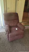 Front view of brown upholstered recliner chair