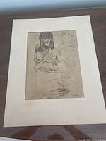 Full view of Picasso print 'Mother and Child' showing the mother holding child and hand studies with cream mount and signature visible.