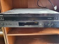 Front view of Yamaha Natural Sound Compact Disc Player CDC-605 showing control buttons and disc tray.